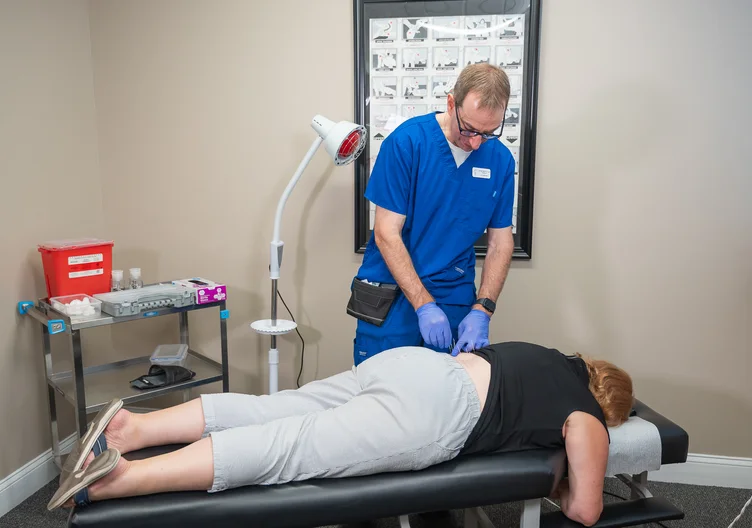 Dr. Paul Abosh performing dry needling at Towson Integrative Health in Towson